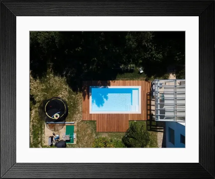 Framed Print : Drone flight over pool with nice wooden terrace surrounded by green lawn in beautiful garden Framed Print : Drone flight over pool with nice wooden terrace surrounded by green lawn in beautiful garden