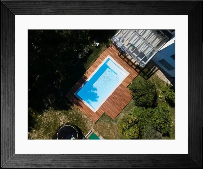 Framed Print : Drone flight over pool with nice wooden terrace surrounded by green lawn in beautiful garden Framed Print : Drone flight over pool with nice wooden terrace surrounded by green lawn in beautiful garden