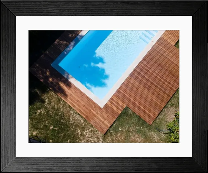 Framed Print : Drone flight over pool with nice wooden terrace surrounded by green lawn in beautiful garden Framed Print : Drone flight over pool with nice wooden terrace surrounded by green lawn in beautiful garden