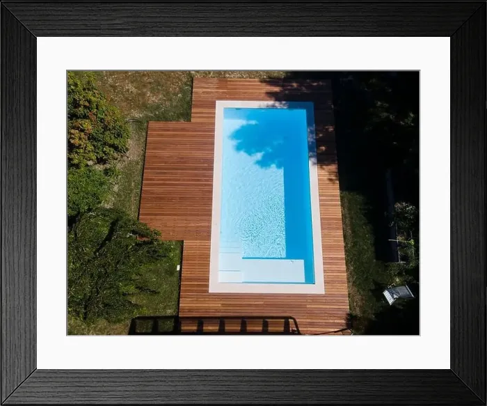 Framed Print : Drone flight over pool with nice wooden terrace surrounded by green lawn in beautiful garden Framed Print : Drone flight over pool with nice wooden terrace surrounded by green lawn in beautiful garden