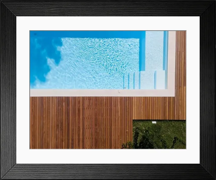 Framed Print : Drone flight over pool with nice wooden terrace surrounded by green lawn in beautiful garden Framed Print : Drone flight over pool with nice wooden terrace surrounded by green lawn in beautiful garden
