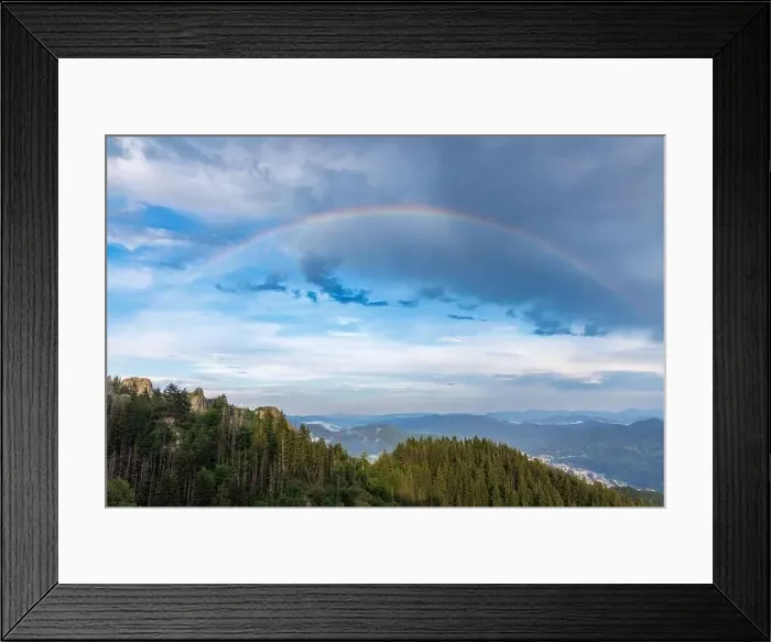 Framed Print : Bright multicolored natural rainbow with different colors on a light daytime cloudy sky Framed Print : Bright multicolored natural rainbow with different colors on a light daytime cloudy sky