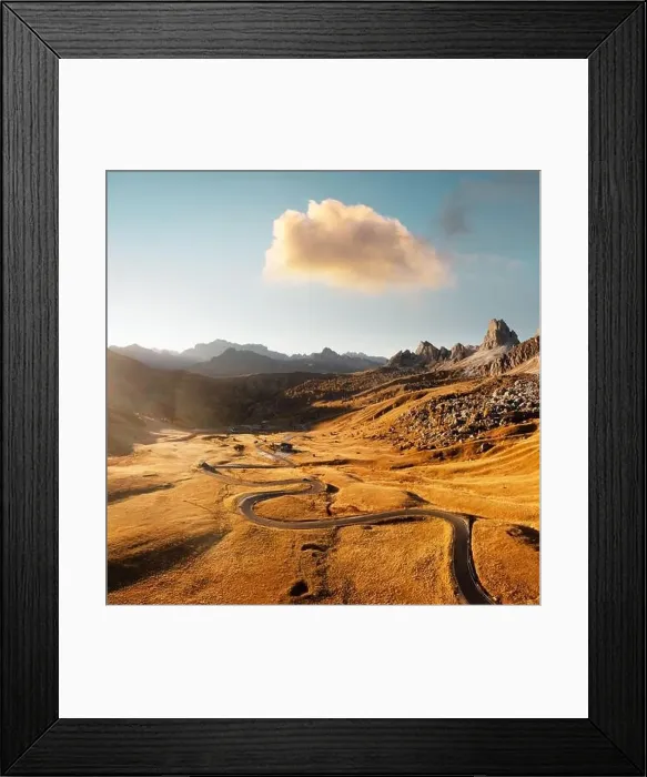 Framed Print : Picturesque aerial view on winding road in autumn mountain valley at sunset Framed Print : Picturesque aerial view on winding road in autumn mountain valley at sunset