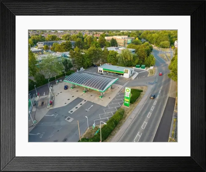 Framed Print : Aerial view of BP petrol station showing high UK fuel price sign Framed Print : Aerial view of BP petrol station showing high UK fuel price sign