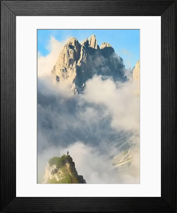 Framed Print : Stunning view of a tourist on the top of a hill enjoying the view of the Cadini di Misurina during a cloudy day Framed Print : Stunning view of a tourist on the top of a hill enjoying the view of the Cadini di Misurina during a cloudy day