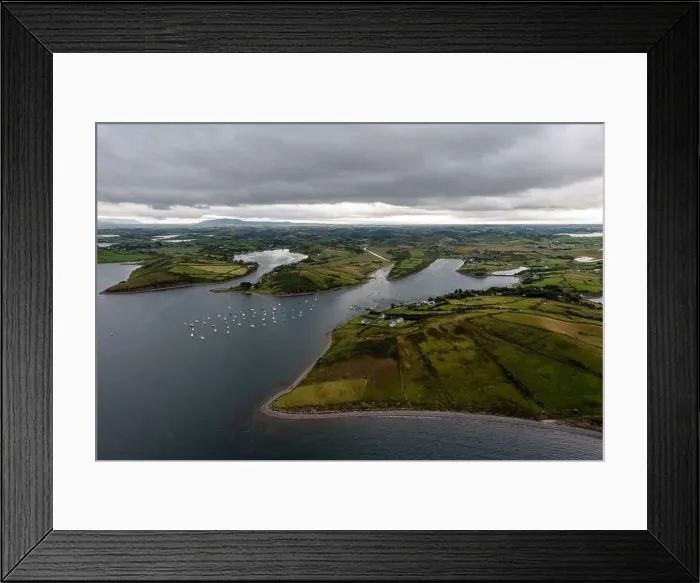 Framed Print : An aerial view of many sailboats anchored in the natural ocean bay near Rosmoney Pier Framed Print : An aerial view of many sailboats anchored in the natural ocean bay near Rosmoney Pier
