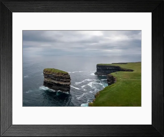 Framed Print : An aerial view of the Downpatrick Head sea stack and cliffs and coastline of northern County Mayo in Ireland Framed Print : An aerial view of the Downpatrick Head sea stack and cliffs and coastline of northern County Mayo in Ireland