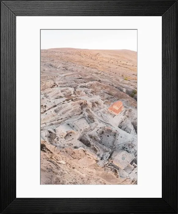 Framed Print : Panoramic view to Uplistsiche cave town caves with basilica in the middle and scenic rocky landscape