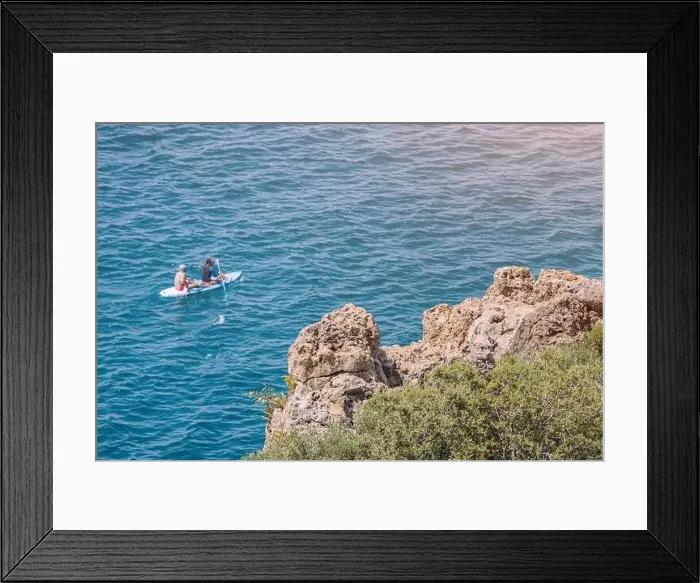 Framed Print : Two people rowing on kayak or sap board swim and travel along the coastal sea zone at the resort Framed Print : Two people rowing on kayak or sap board swim and travel along the coastal sea zone at the resort