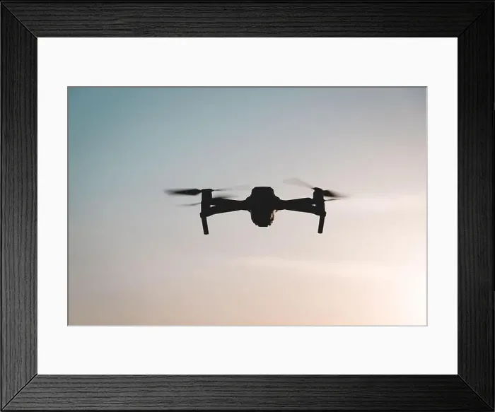 Framed Print : The drone is in flight at sunset Framed Print : The drone is in flight at sunset