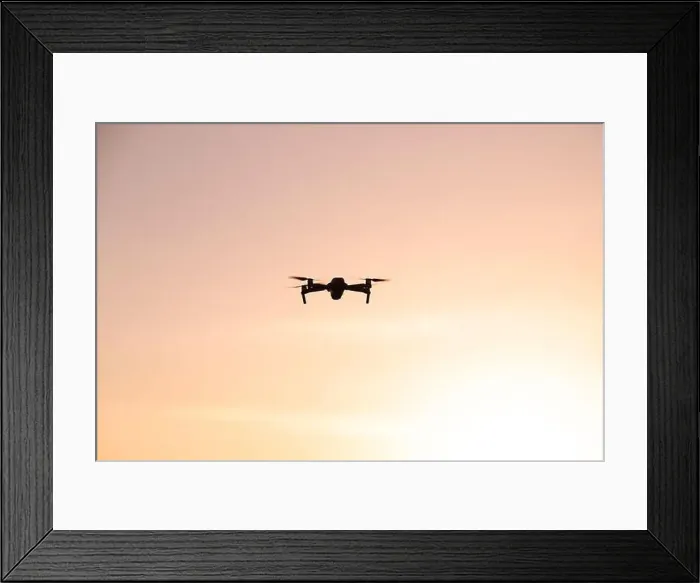 Framed Print : The drone is in flight at sunset Framed Print : The drone is in flight at sunset