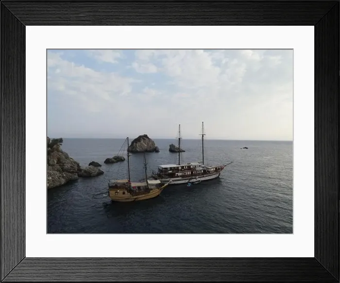 Framed Print : Aerial View Pirate Ships Near Island Of Panagia In Famous Tourist Destination Parga Town The Greek Caribbean Of Epirus Framed Print : Aerial View Pirate Ships Near Island Of Panagia In Famous Tourist Destination Parga Town The Greek Caribbean Of Epirus