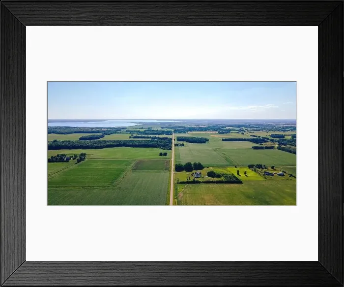 Framed Print : A rural scene of wisconsin farms during summer with lake winneconnie in the background Framed Print : A rural scene of wisconsin farms during summer with lake winneconnie in the background