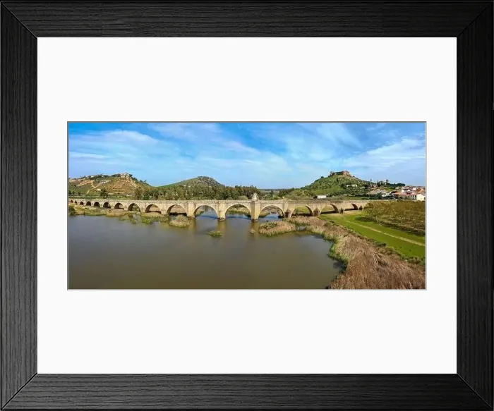 Framed Print : Aerial panorama view of the Guadiana River and the town of Medellin with old bridge and castle Framed Print : Aerial panorama view of the Guadiana River and the town of Medellin with old bridge and castle