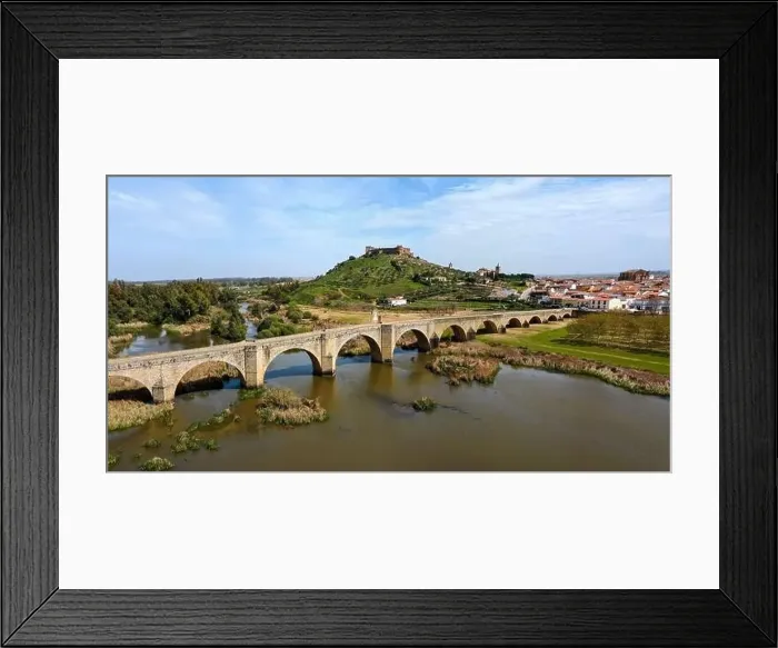 Framed Print : Aerial panorama view of the Guadiana River and the town of Medellin with old bridge and castle Framed Print : Aerial panorama view of the Guadiana River and the town of Medellin with old bridge and castle