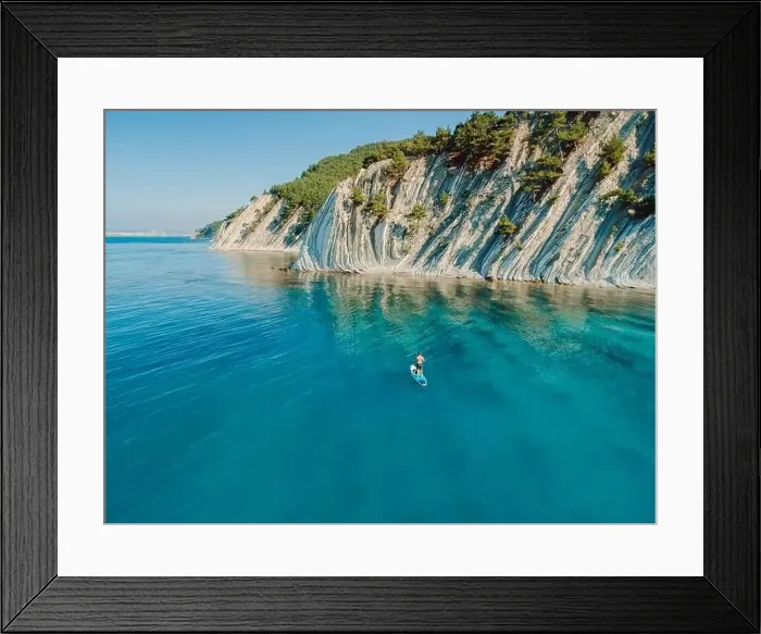 Framed Print : Man on stand up paddle board in blue sea Framed Print : Man on stand up paddle board in blue sea