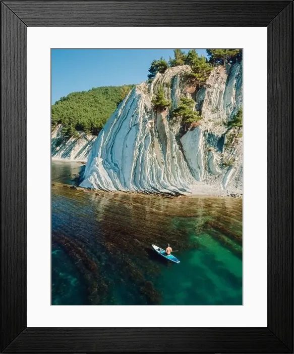 Framed Print : Man relax on stand up paddle board in blue sea Framed Print : Man relax on stand up paddle board in blue sea