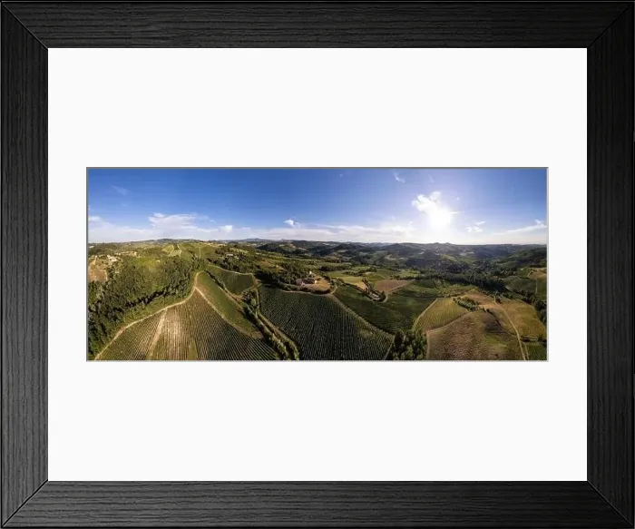 Framed Print : Vineyard plantations, panoramic aerial view north of Italy. Blue sky, clouds, countryside hills in Summer Framed Print : Vineyard plantations, panoramic aerial view north of Italy. Blue sky, clouds, countryside hills in Summer