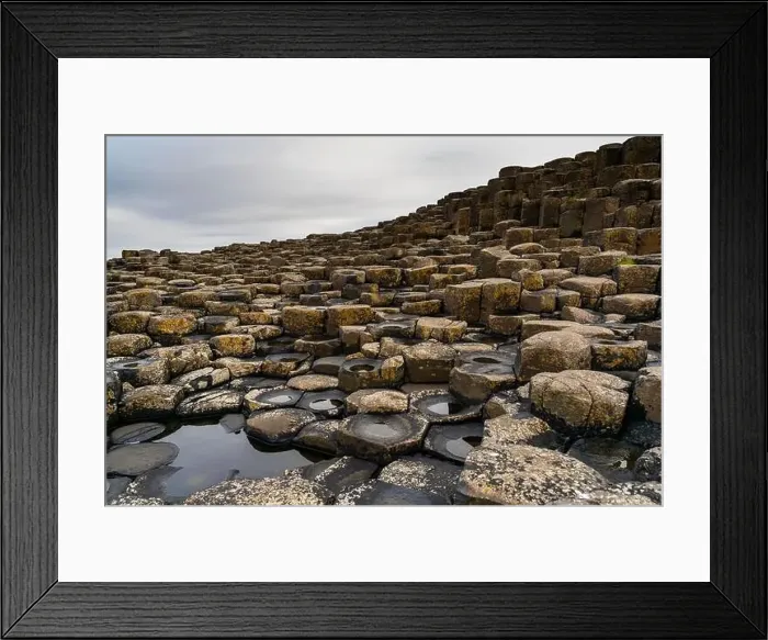 Framed Print : A view of the many volcanic basalt columns of the Giant's Causeway in Northern Ireland Framed Print : A view of the many volcanic basalt columns of the Giant's Causeway in Northern Ireland