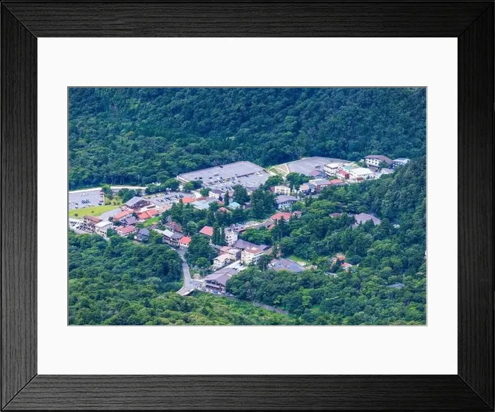 Framed Print : Aerial view of small mountain resort town and empty parking lots in off season Framed Print : Aerial view of small mountain resort town and empty parking lots in off season