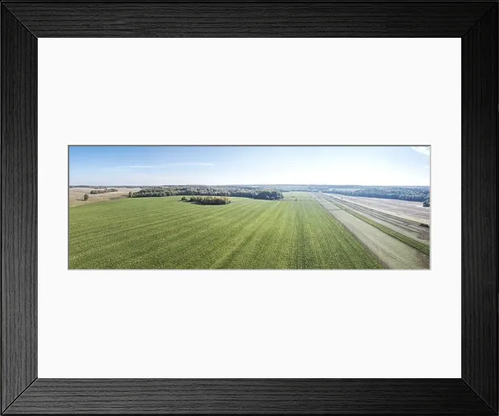 Framed Print : aerial view of a country road between agricultural fields. wide panorama Framed Print : aerial view of a country road between agricultural fields. wide panorama