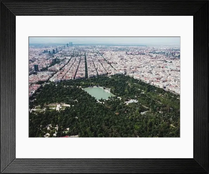 Framed Print : From above aerial drone view shot of city with dense infrastructure with lake and park in El Retiro in Madrid, Spain Framed Print : From above aerial drone view shot of city with dense infrastructure with lake and park in El Retiro in Madrid, Spain