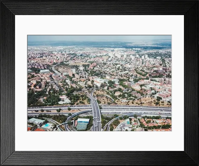 Framed Print : From above aerial drone view shot of city with dense infrastructure in Madrid, Spain Framed Print : From above aerial drone view shot of city with dense infrastructure in Madrid, Spain