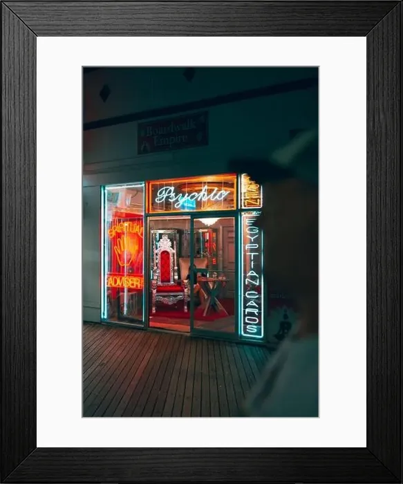 Framed Print : A vertical shot of neon signs lit at night at Boardwalk Empire Framed Print : A vertical shot of neon signs lit at night at Boardwalk Empire