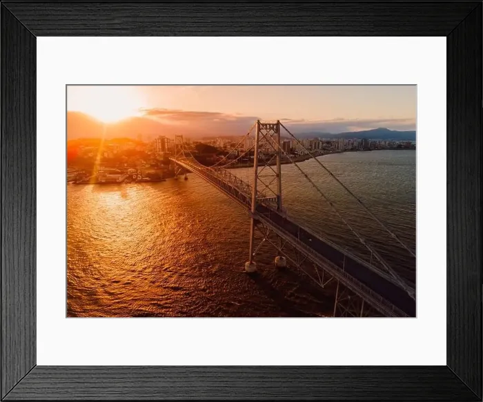 Framed Print : Cable bridge with sunset light in Florianopolis, Brazil. Aerial view Framed Print : Cable bridge with sunset light in Florianopolis, Brazil. Aerial view