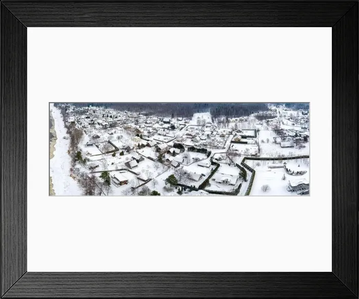 Framed Print : Snow covered village in Baltic sea shore