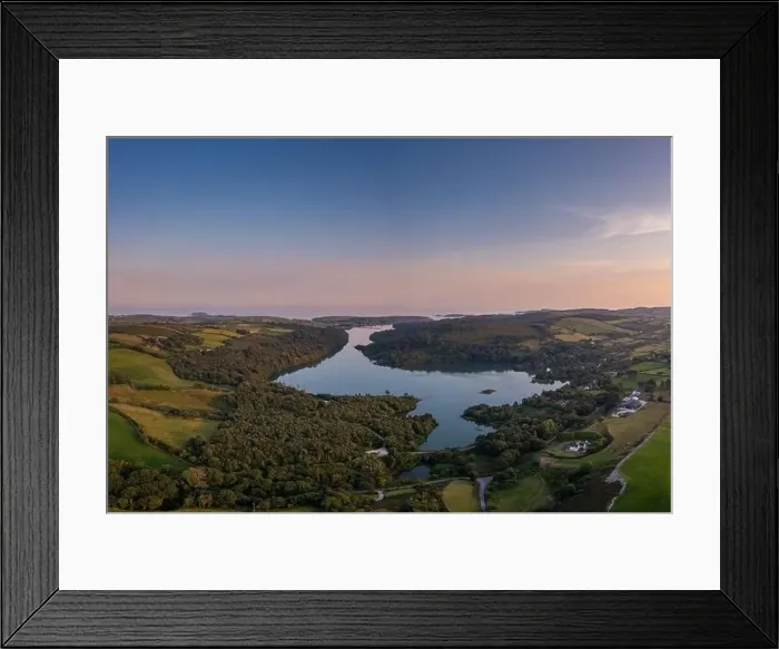 Framed Print : A view of Castlehaven Bay and Rineen Woods in West Cork in warm evening light Framed Print : A view of Castlehaven Bay and Rineen Woods in West Cork in warm evening light