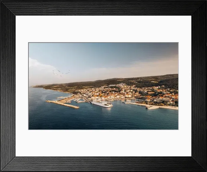 Framed Print : Aerial drone view of Adriatic island at sunset. The town of Supetar on Brach island at dawn.Tourist destination Europe Framed Print : Aerial drone view of Adriatic island at sunset. The town of Supetar on Brach island at dawn.Tourist destination Europe