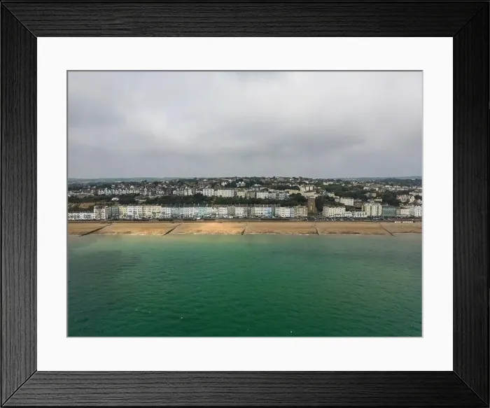 Framed Print : Hastings seafront, England. The seafront to the East Sussex town of Hastings drone shot of shore and city Framed Print : Hastings seafront, England. The seafront to the East Sussex town of Hastings drone shot of shore and city