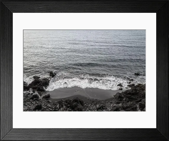 Framed Print : Black sand beach aerial view. Grey and black volcanic rocks and ocean waves Framed Print : Black sand beach aerial view. Grey and black volcanic rocks and ocean waves