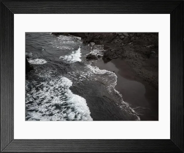 Framed Print : Black sand beach aerial view. Small volcanic rocks and graphic diagonal waves Framed Print : Black sand beach aerial view. Small volcanic rocks and graphic diagonal waves