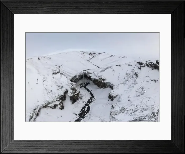 Framed Print : Breathtaking drone view of snowy mountain with waterfall Framed Print : Breathtaking drone view of snowy mountain with waterfall