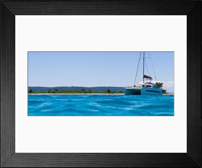 Framed Print : catamaran sailing in ocean. paradice at sea. Blue sky and turquoise blue sea water Framed Print : catamaran sailing in ocean. paradice at sea. Blue sky and turquoise blue sea water