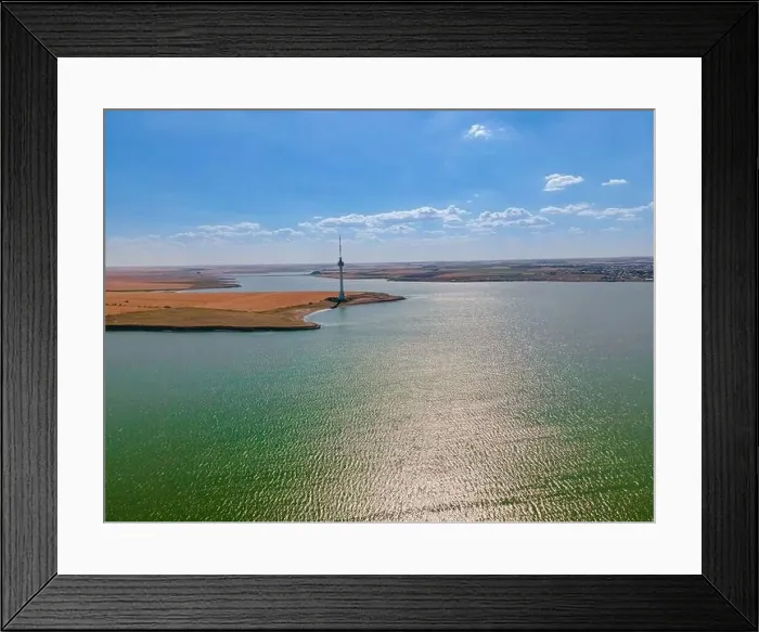 Framed Print : Aerial photography over Techirghiol lake with a patch of land and the radio TV relay on it at Eforie Framed Print : Aerial photography over Techirghiol lake with a patch of land and the radio TV relay on it at Eforie