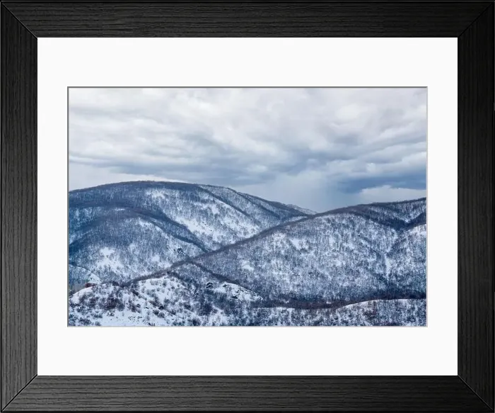 Framed Print : An aerial view of Trees in the forest and mountains with covered snow. High quality photo Framed Print : An aerial view of Trees in the forest and mountains with covered snow. High quality photo