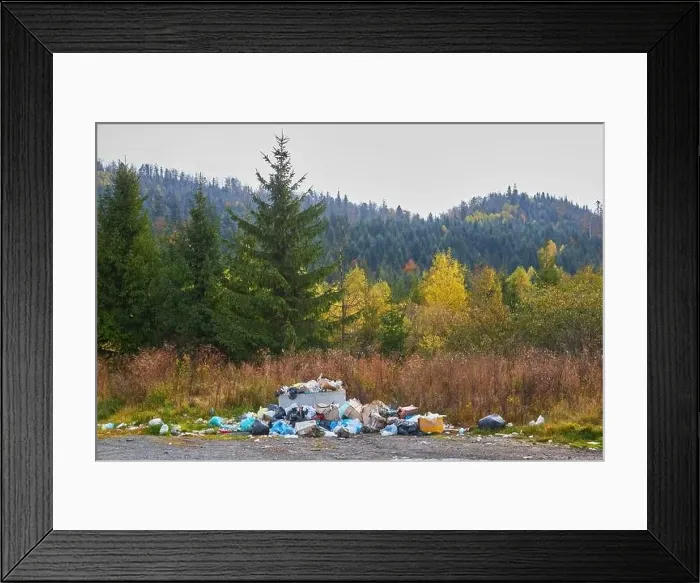 Framed Print : A pile of garbage lies on the background of beautiful mountains Framed Print : A pile of garbage lies on the background of beautiful mountains