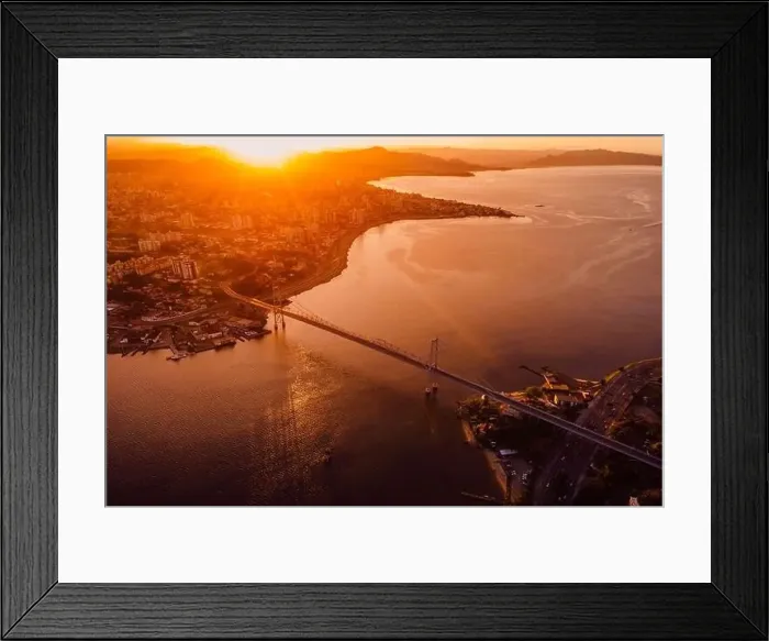 Framed Print : Aerial view of city and Hercilio luz bridge with bright sunset in Florianopolis, Brazil Framed Print : Aerial view of city and Hercilio luz bridge with bright sunset in Florianopolis, Brazil
