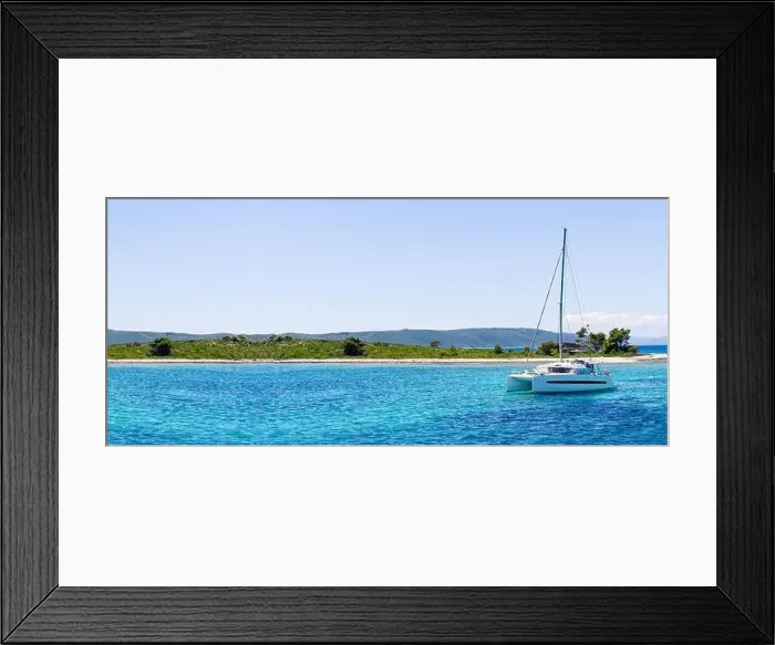 Framed Print : catamaran sailing in ocean. paradice at sea. Blue sky and turquoise blue sea water Framed Print : catamaran sailing in ocean. paradice at sea. Blue sky and turquoise blue sea water