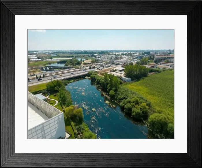 Framed Print : Aerial view of riverside highway on a sunny day Framed Print : Aerial view of riverside highway on a sunny day