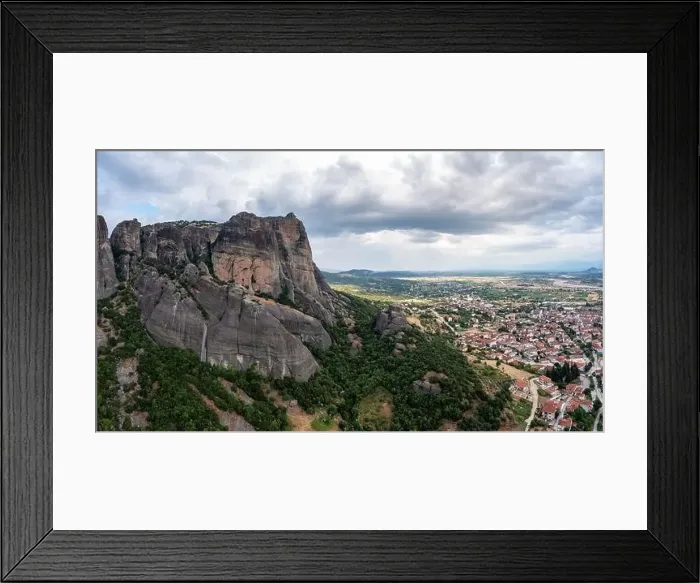 Framed Print : Meteora Greece. Blue sky with clouds over Monastery buildings on top of rocks and Kalambaka town and valley Framed Print : Meteora Greece. Blue sky with clouds over Monastery buildings on top of rocks and Kalambaka town and valley