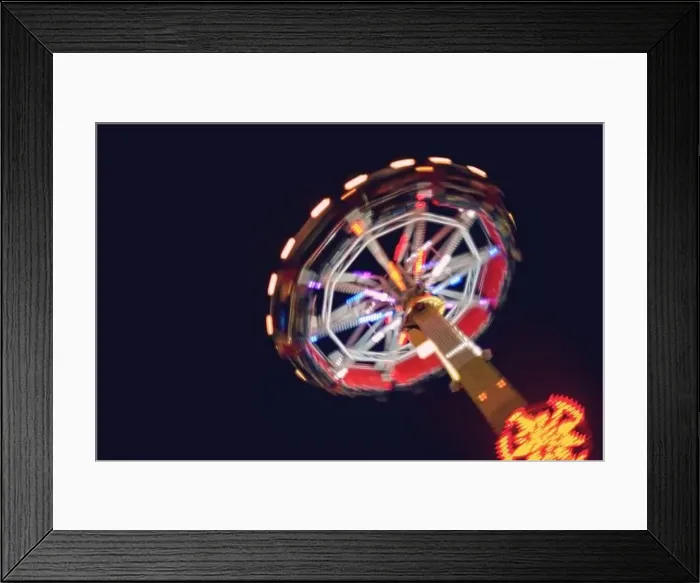 Framed Print : Defocused and motion blurred photo of Evolution named fun device in the izmir amusement park Framed Print : Defocused and motion blurred photo of Evolution named fun device in the izmir amusement park