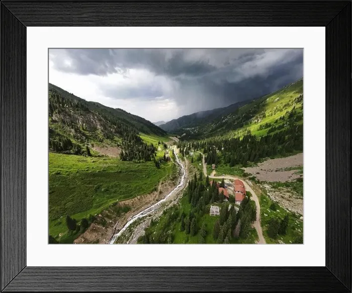 Framed Print : Beautiful scenery of the mountains with green hill and river in at storm rain cloudy sky and resort in Almaty Framed Print : Beautiful scenery of the mountains with green hill and river in at storm rain cloudy sky and resort in Almaty