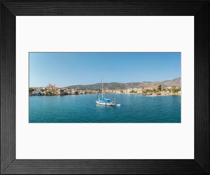 Framed Print : Galaxidi Greece, sunny day. Sailboat anchored on calm sea, traditional waterfront houses background Framed Print : Galaxidi Greece, sunny day. Sailboat anchored on calm sea, traditional waterfront houses background