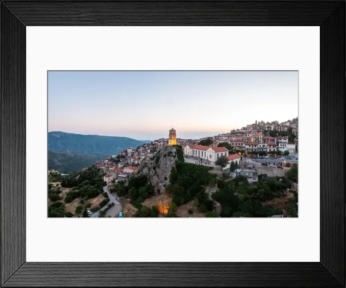 Framed Print : Arachova Greece mountain town aerial drone view. Traditional houses and illuminated stone tower clock, in the evening Framed Print : Arachova Greece mountain town aerial drone view. Traditional houses and illuminated stone tower clock, in the evening