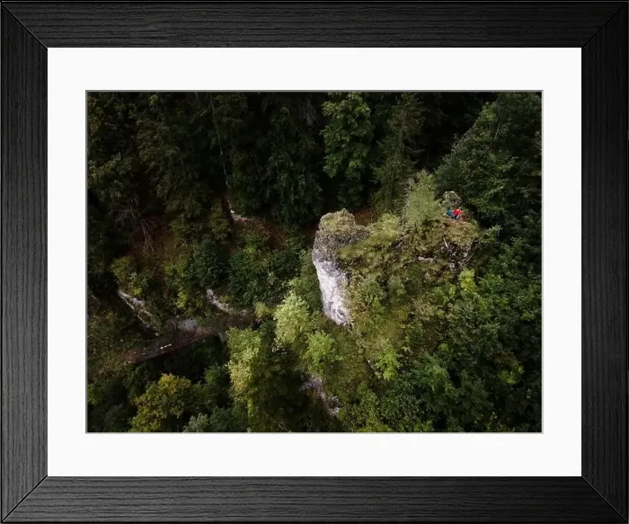 Framed Print : Hiker, middle-aged climber is on rock Framed Print : Hiker, middle-aged climber is on rock