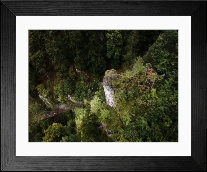 Framed Print : Hiker, middle-aged climber is on rock Framed Print : Hiker, middle-aged climber is on rock